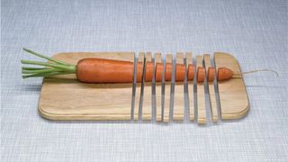 KNSK advert featuring a carrot on a chopped up chopping board