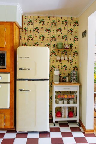 vintage kitchen grandmillennial with vintage fridge, check tiles, butlers trolley, 50s style wallpaper