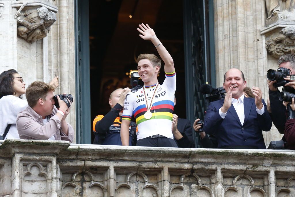 Belgian Remco Evenepoel new cycling world champion stands on stage during celebrations after his return from the UCI Road World Championships Cycling 2022 in Brussels on September 27 2022 The 22yearold from Schepdael Dilbeek became world champion after a great season with a win also at the Vuelta the first Belgian in 44 years to win a big tour Belgium OUT Photo by NICOLAS MAETERLINCK BELGA AFP Belgium OUT Photo by NICOLAS MAETERLINCKBELGAAFP via Getty Images