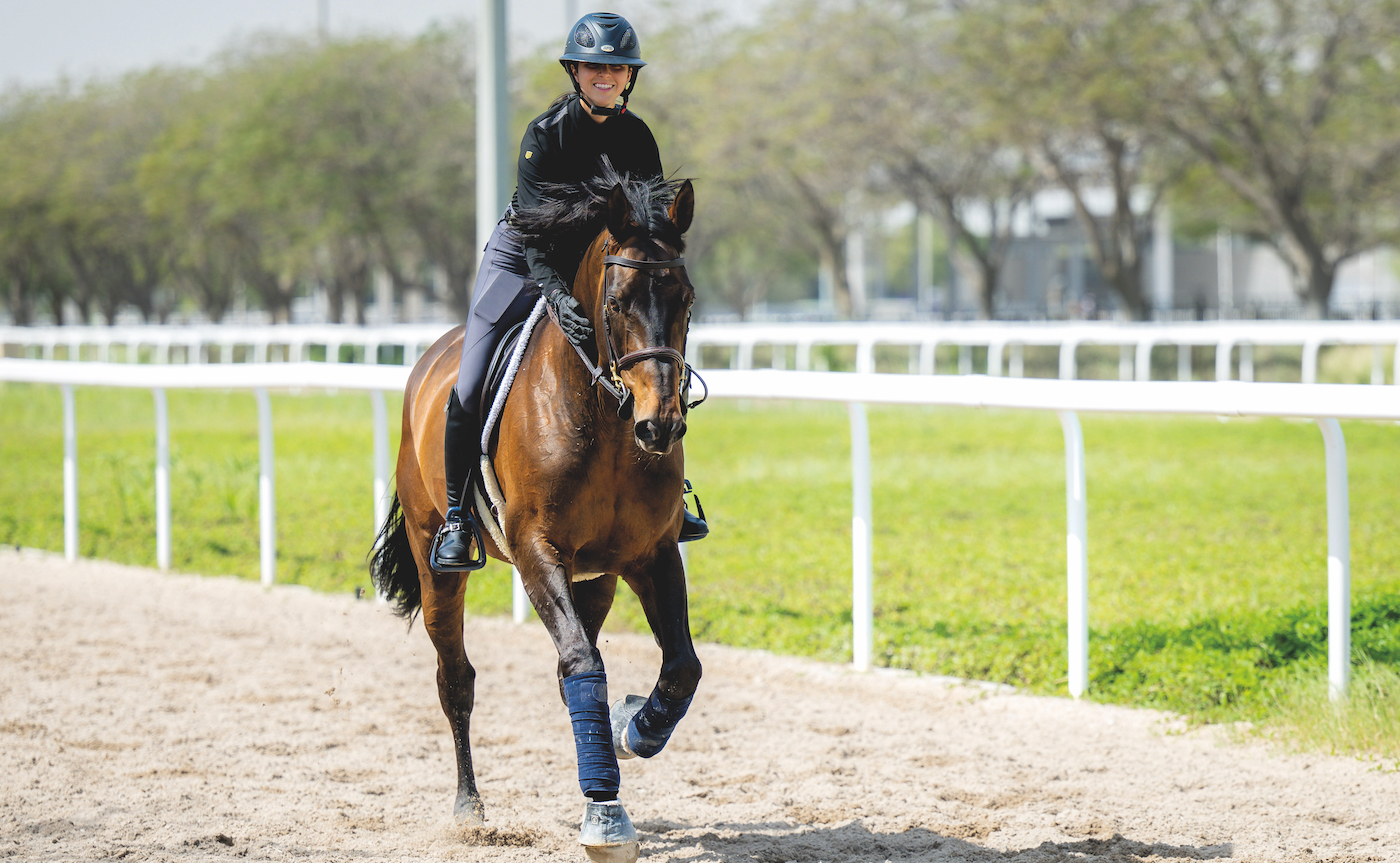 Showjumper Levis De Muze cantering along canter track in Doha