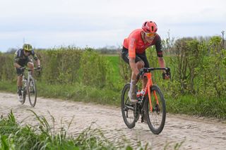 Josh Tarling (Ineos Grenadiers) rides an early cobbled sector before getting disqualified from the 2024 Paris-Roubaix