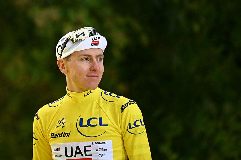 UAE Team Emirates - XRG team&#039;s Slovenian rider Tadej Pogacar celebrates on the podium with the overall leader&#039;s yellow jersey after the 21st and final stage of the 112th edition of the Tour de France cycling race, 132.3 km between Mantes-la-Ville and Paris Champs-Élysees, on July 27, 2025. (Photo by Loic VENANCE / AFP)