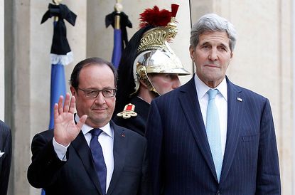 U.S. Secretary of State John Kerry with French President Francois Hollande.