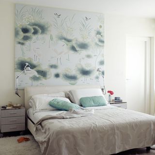 bedroom with white wall and wallpaper headboard