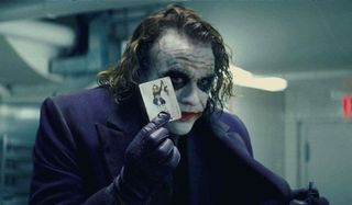 The Dark Knight Joker shows his card to the crowd