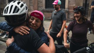 Hugs between cyclists at the end of the Rapha Pennine Way 2022