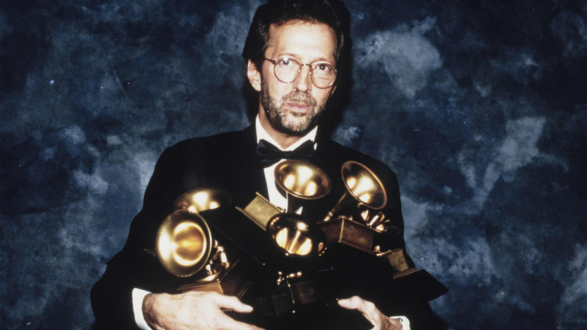 Eric Clapton poses with the six Grammys he won at the 35th annual Grammy Awards. His song "Tears in Heaven" won both as record and song of the year, and his album "Unplugged" won as album of the year, United States, 24th February 1993.
