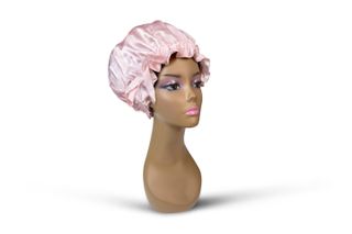 Kim Kimble Silk Slumber Cap in pink on a mannequin on a white background