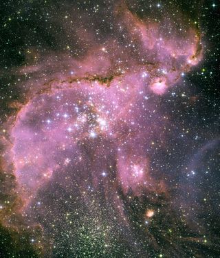 This Hubble Space Telescope view shows the star cluster NGC 346 at the center of a brilliant star-forming region inside the Small Magellanic Cloud, a small satellite galaxy of our Milky Way about 210,000 light-years away.