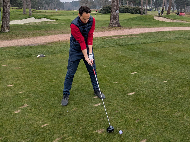 a golfer about to hit a tee shot at West Hill Golf Club