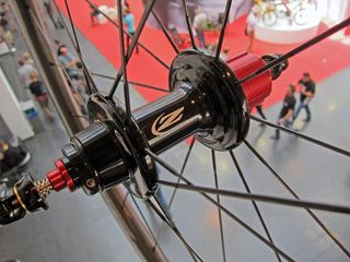 The new Zipp 303 Firecrest rear hub features wider bearing spacing and a canted non-driveside spoke flange for improved lateral stiffness