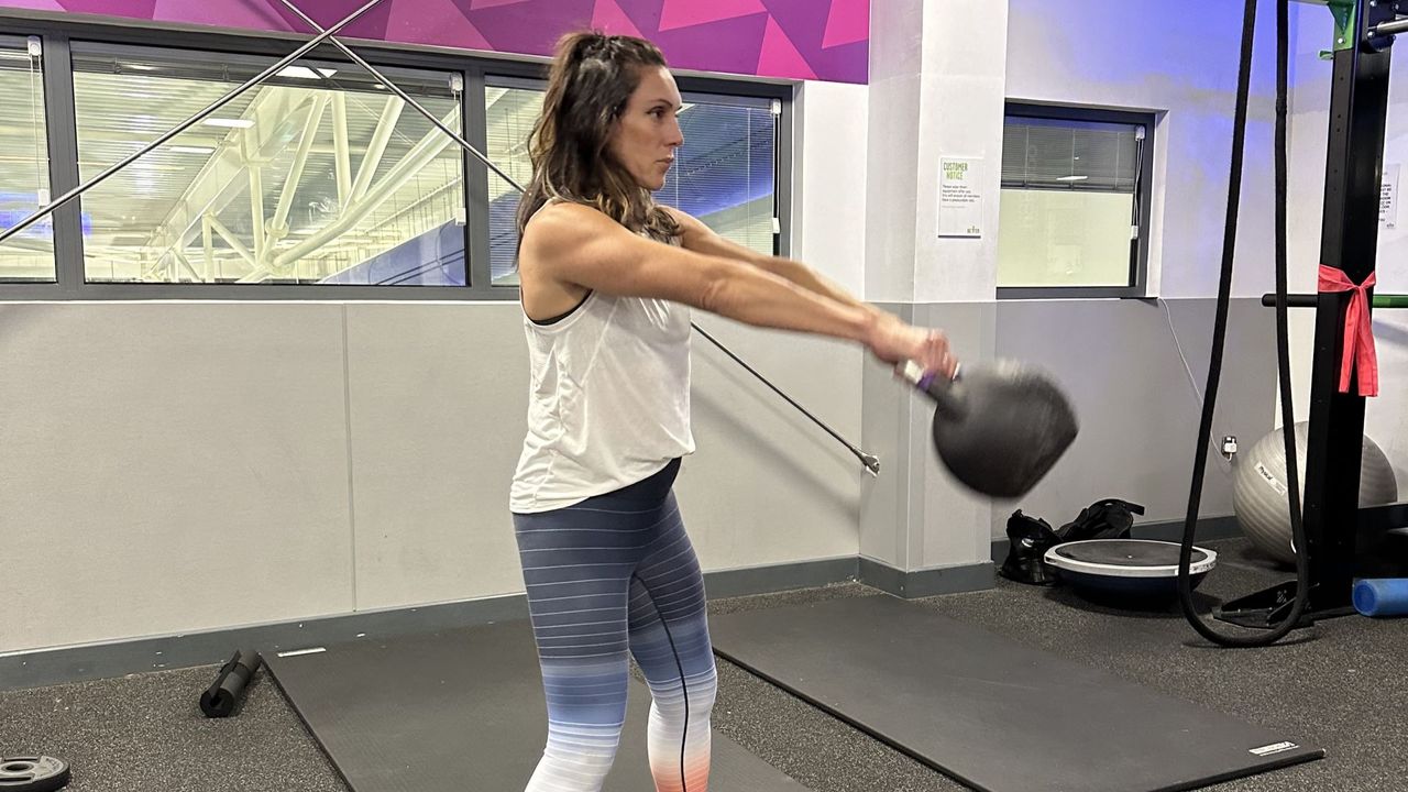 Personal trainer Jo Burland demonstrates a kettlebell swing