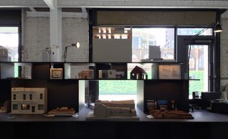 3D models of architecture displayed on shelving