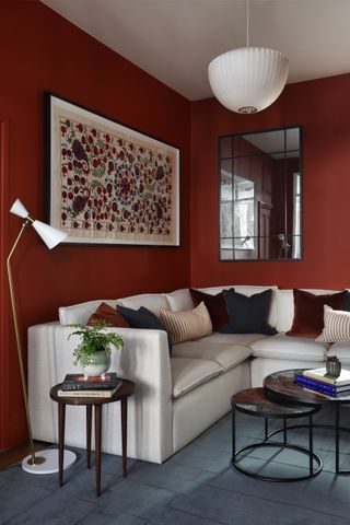 Small red living room with corner sofa