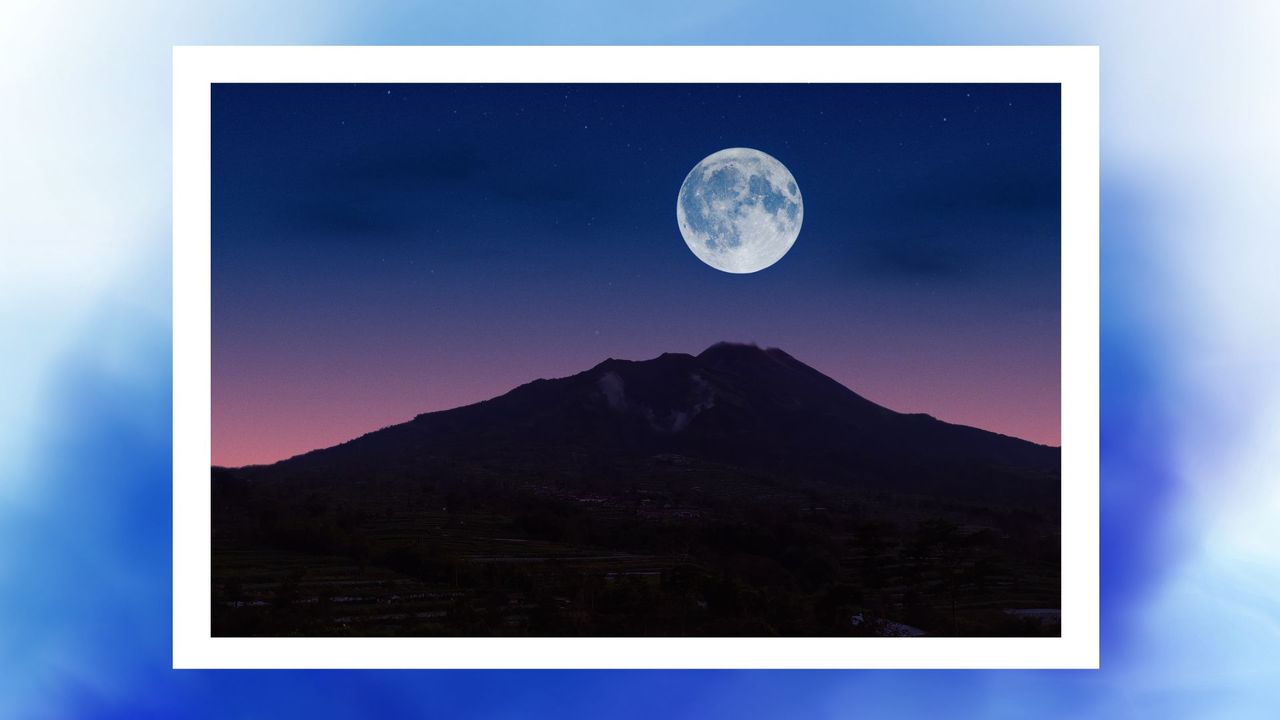 a blue moon over a mountain with a sunset on a baby blue background 