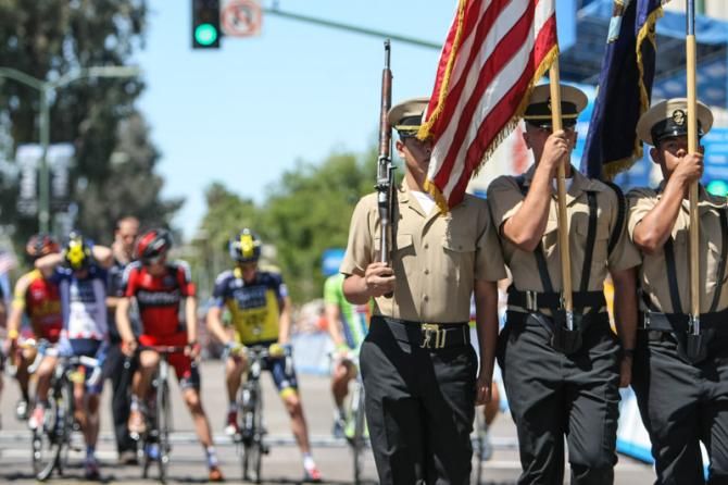 The local color guard finishes up before the start.