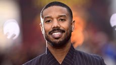 michael b. jordan on an orange background