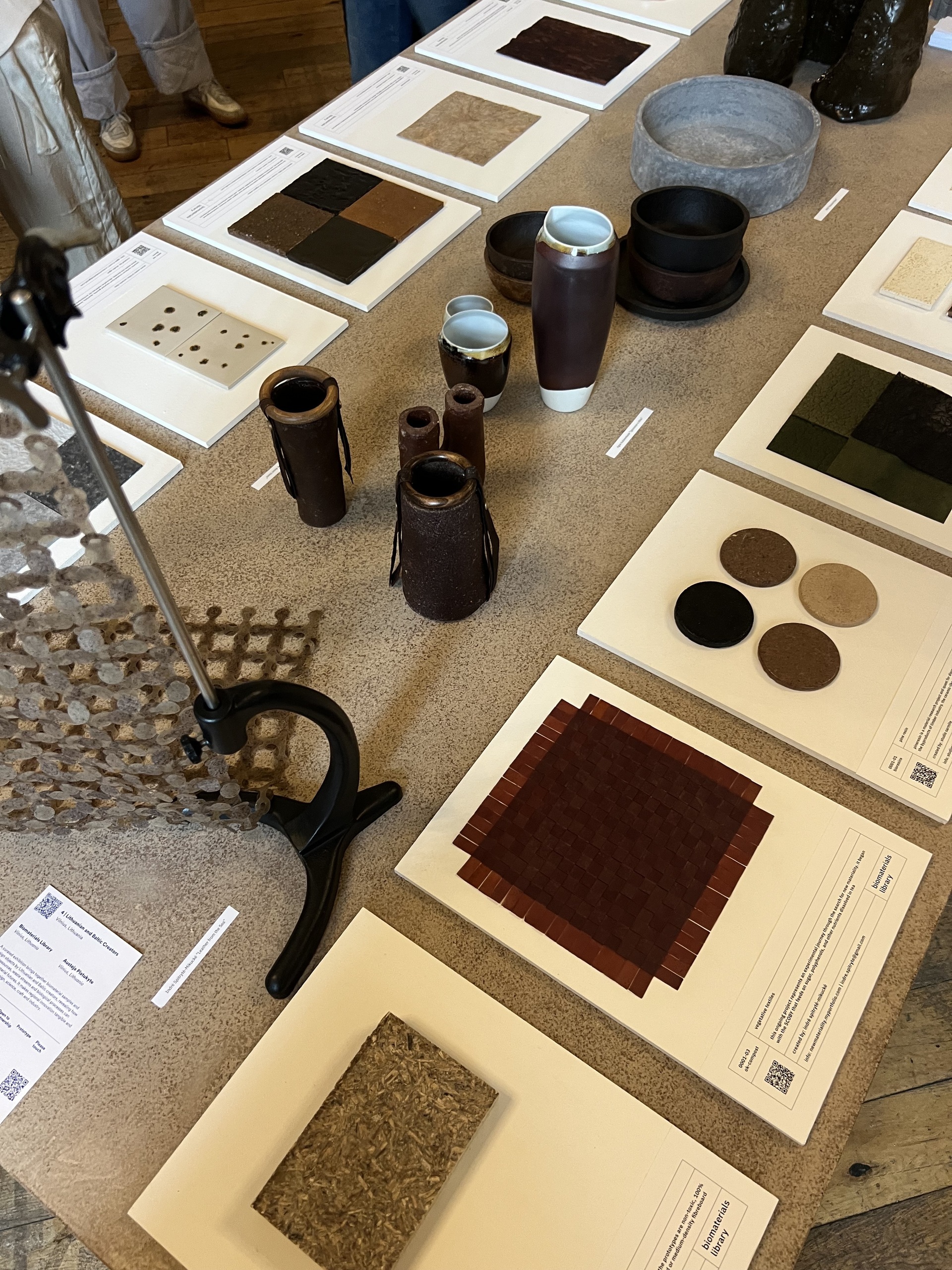Image of a table from above that is showing several different interior design materials that are all made from sustainable sources.