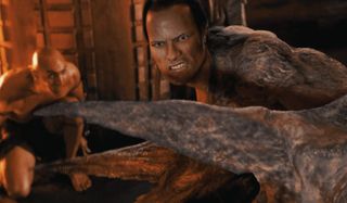 The Rock sneers in front of a bowing Arnold Vosloo in The Mummy Returns.