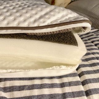 The Emma Premium pillow unzipped to show its three foam inserts