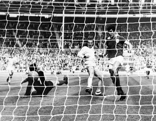 Jose Altafini (centre) scores for AC Milan against Benfica in the 1963 European Cup final at Wembley.