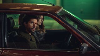 ben whishaw and keira knightley ride in a car together in black doves