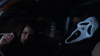 Sidney crawls over Ghostface in Scream 2