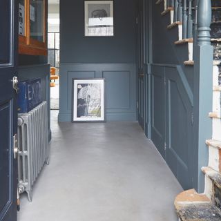Cement flooring in blue hallway