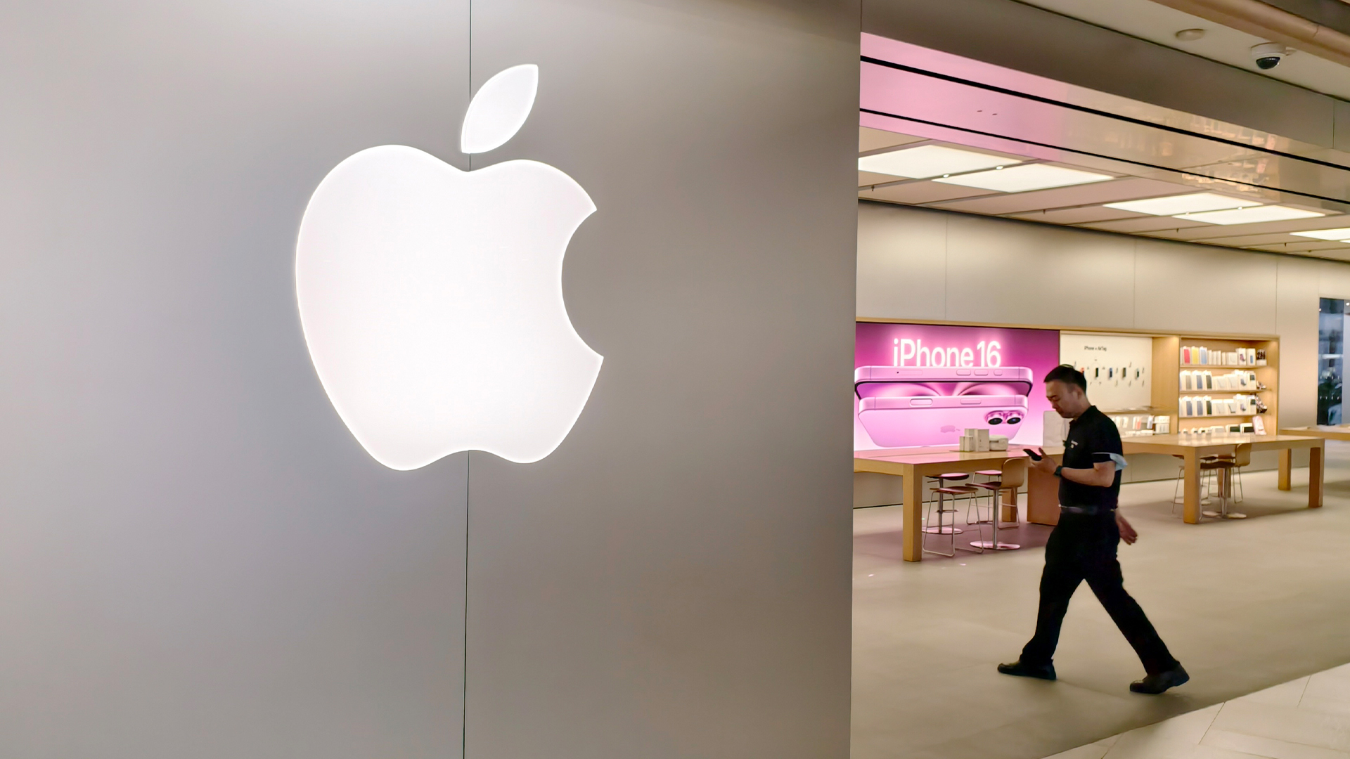 A pedestrian passes by an Apple smart products flagship store on Nanjing Road in Shanghai, China on June 29, 2025.