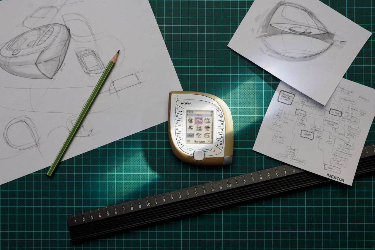 From the Nokia Design Archive, &quot;Mango phone&quot; (Nokia 7600), surrounded by designer Tej Chauhan&#039;s sketches