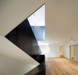 Interior featuring angular aspects and wooden floors