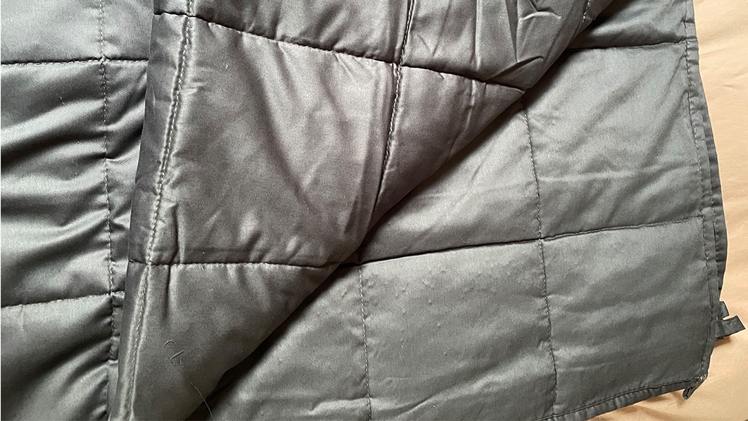 Luna Weighted Blanket review: image shows the blanket open on a bed