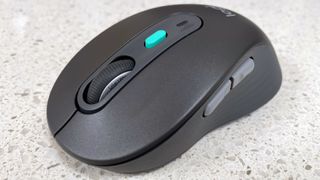 The Logitech Signature AI Edition M750 mouse on a worktop.