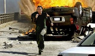 Mission: Impossible III Tom Cruise Ethan Hunt runs from an exploded car on the bridge