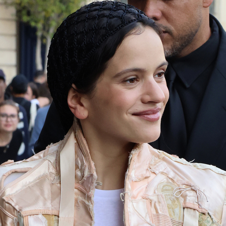 Rosalia in Paris wearing a strappy coat