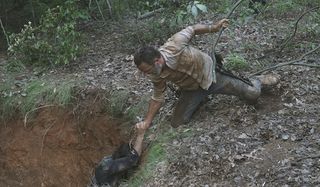 daryl and rick climbing out of hole after fight the walking dead season 9