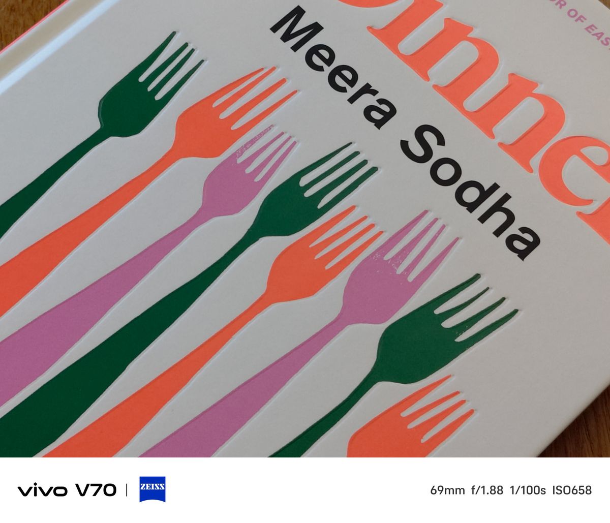 Close-up of colourful fork illustrations on a book cover reading &ldquo;Dinner&rdquo; by Meera Sodha.