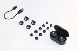Black earbuds with charging cable, case and accessories