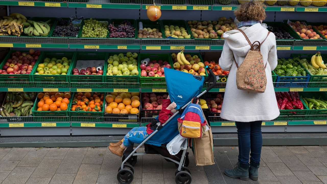 Woman buying fruit