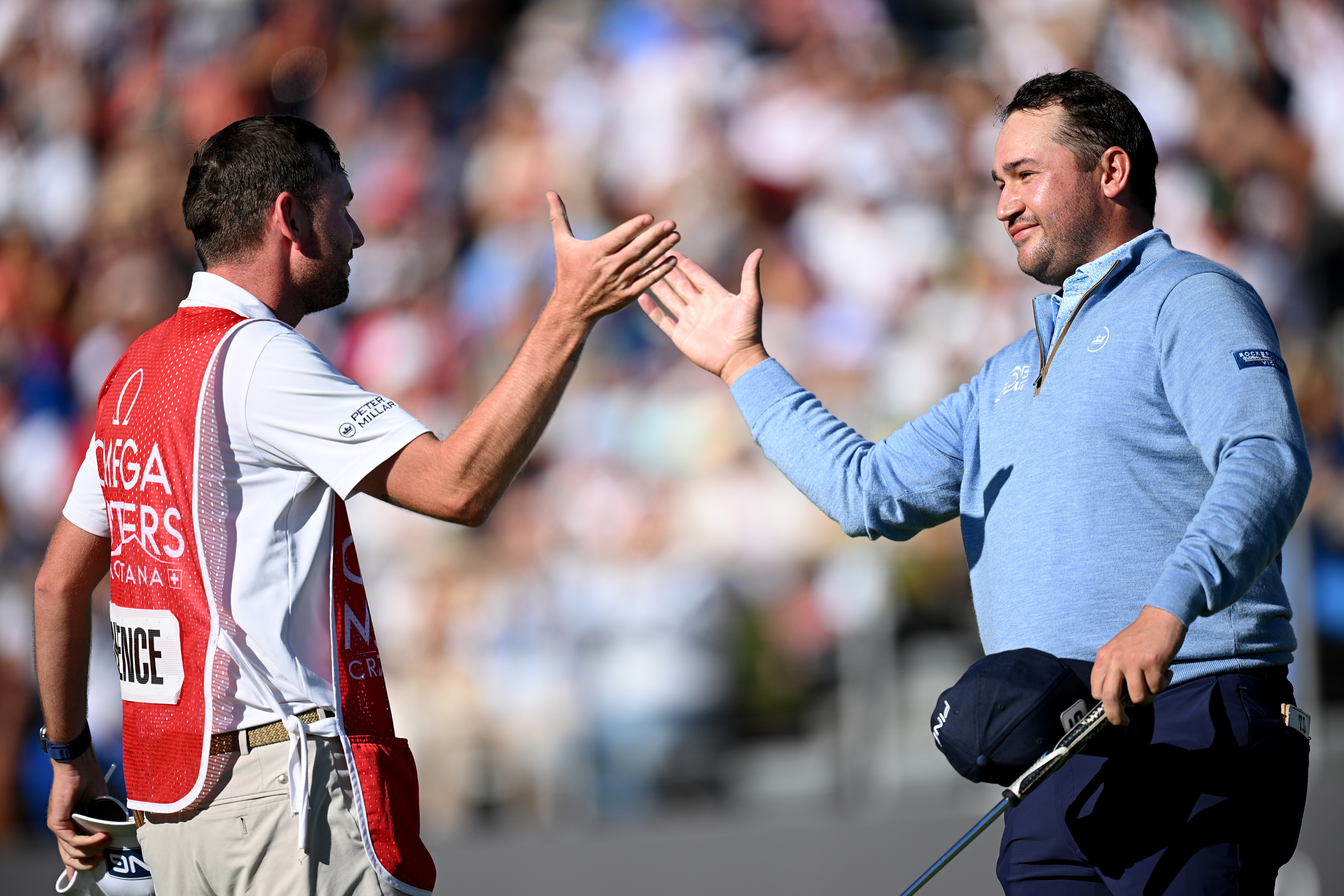Thriston Lawrence and his caddie shake hands