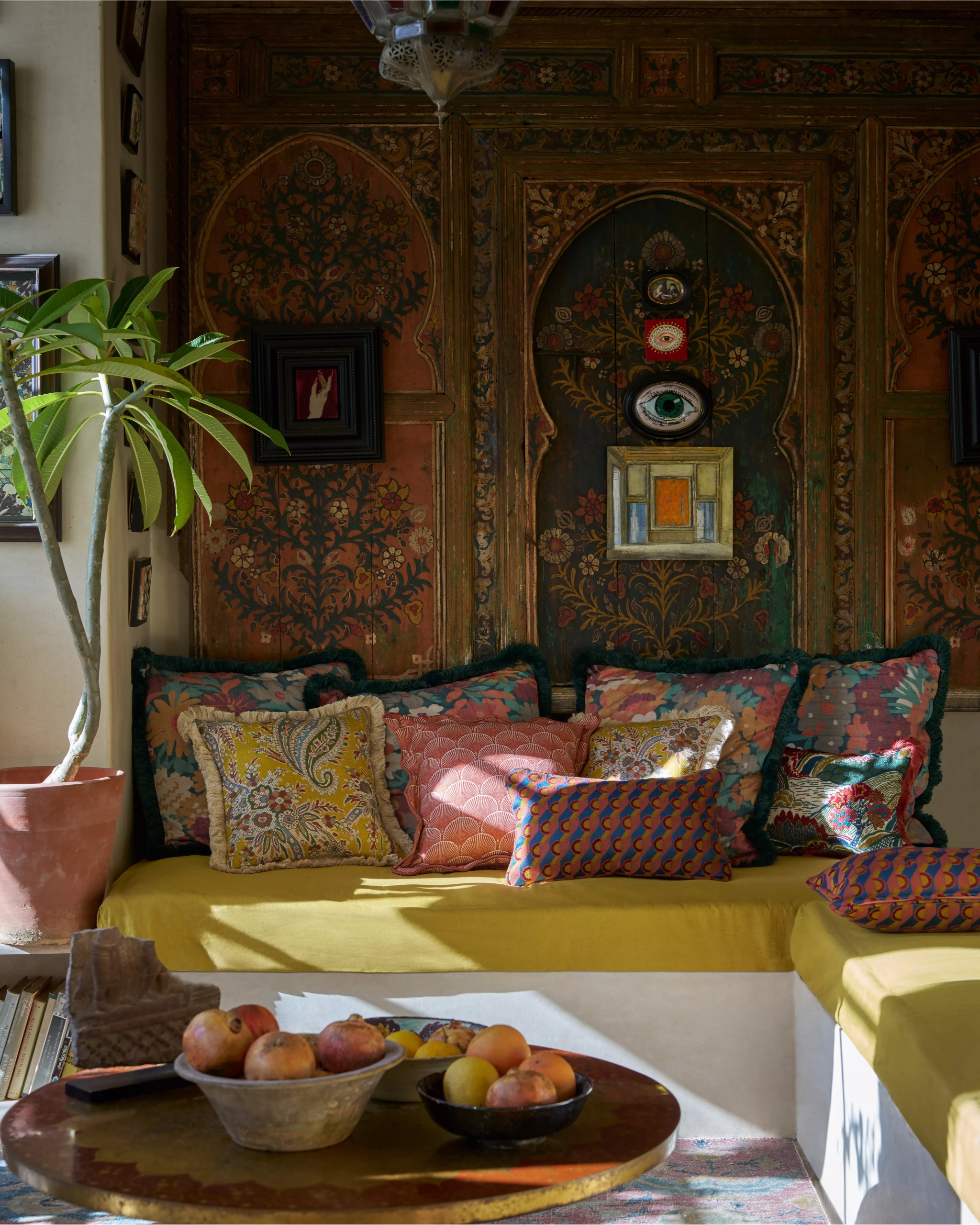 an eastern-inspired seating area with cushions in liberty fabric prints