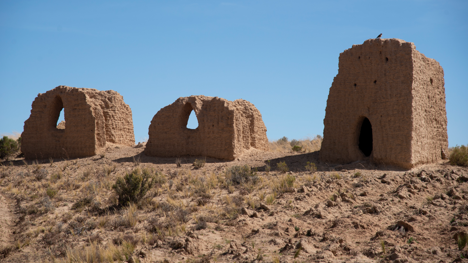 three brick tombs in the Bolivian desert