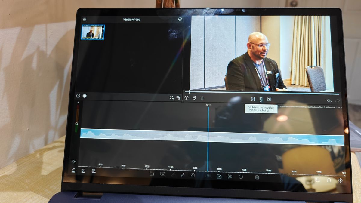 Close up of a laptop display, with a video editing window open on screen.