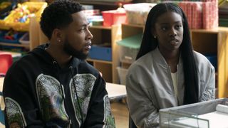 Jacob Latimore as Emmett and Birgundi Baker as Kiesha sitting at table in The Chi season 5