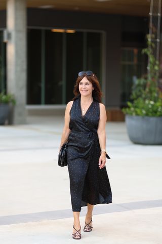 AReplica Store buyer wearing a polka dot dress.