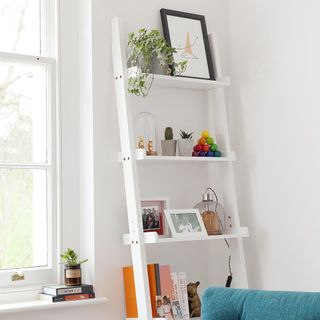 white ladder and white walls