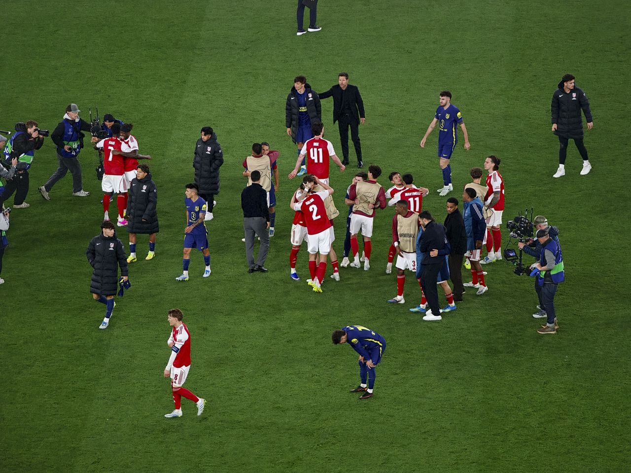 Action photos during a Champions League soccer match at Arsenal's Emirates stadium, taken with the Oppo Find X9 Ultra and teleconverter lens