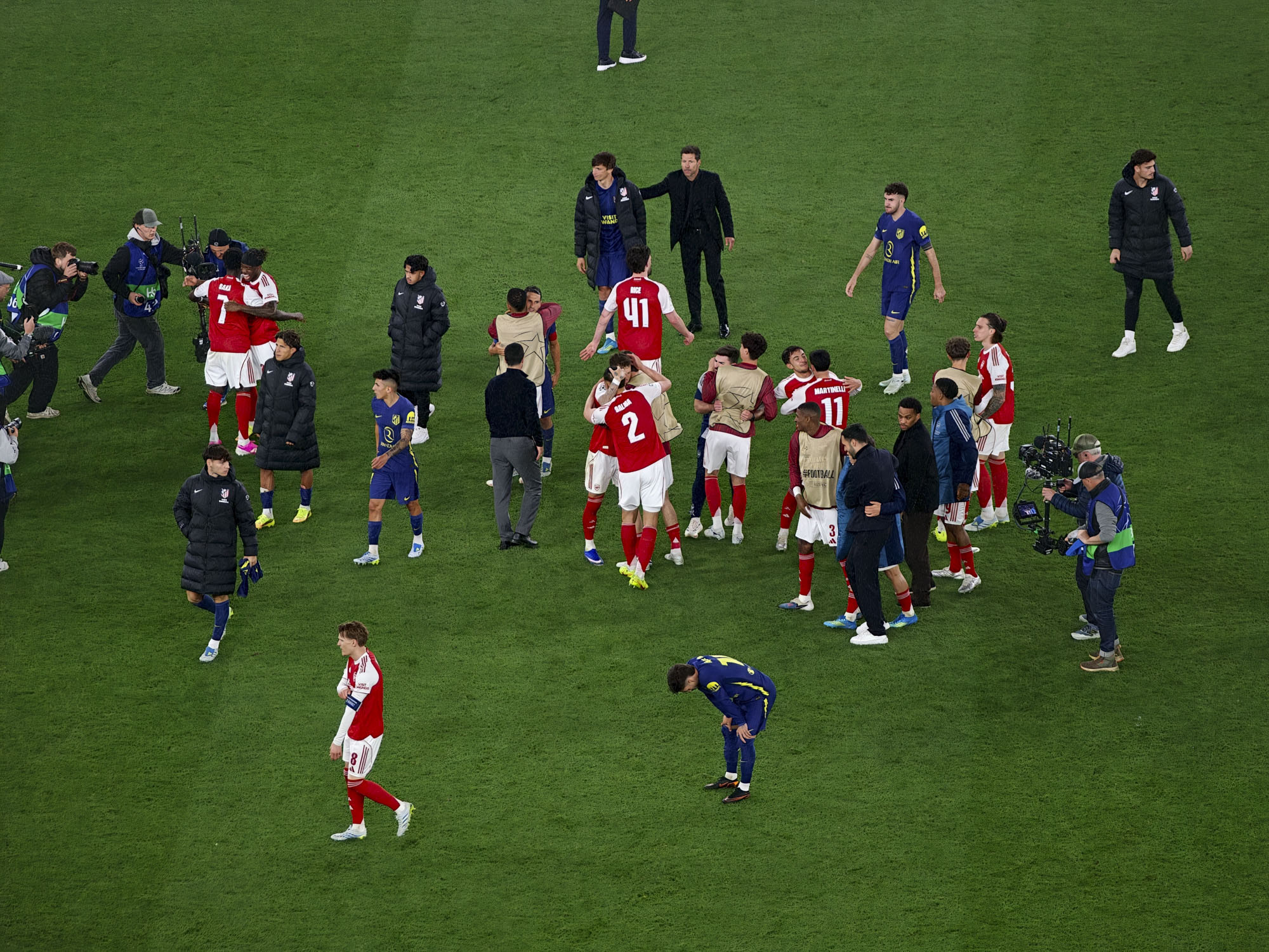 Action photos during a Champions League soccer match at Arsenal's Emirates stadium, taken with the Oppo Find X9 Ultra and teleconverter lens