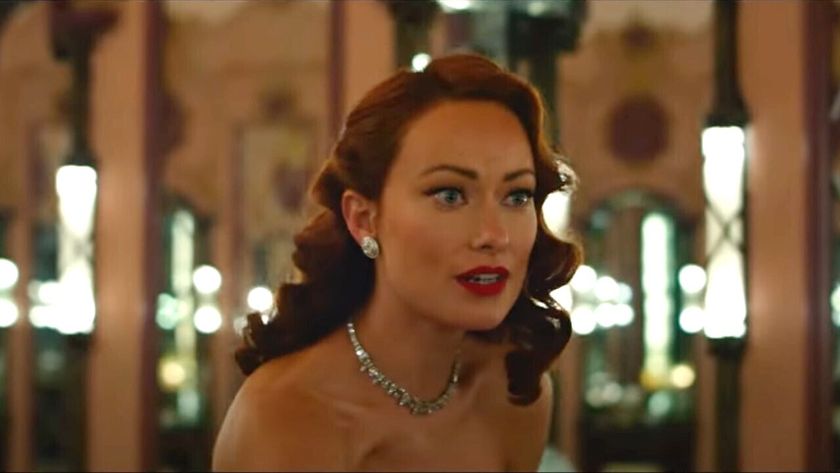 Olivia Wilde in Don't Worry Darling talking nervously to Florence Pugh in a bathroom. 