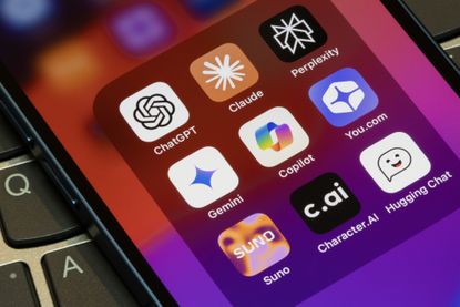 Assorted AI apps on an iPhone, including ChatGPT, Claude, Perplexity, Gemini, Microsoft Copilot, You.com, Suno, Character.AI, and Hugging Chat.
